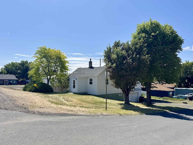 216 NW Cole Ave, Wilbur, WA 99185 - view of home's exterior featuring a chimney