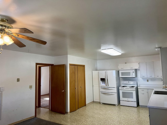 216 NW Cole Ave, Wilbur, WA 99185 - kitchen with white appliances, a sink, ceiling fan, light countertops, and baseboards