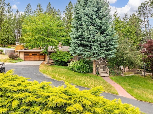 4012 S Terra Verde Dr, Veradale, WA 99037 - view of front of house with a front yard, a garage, and stairs