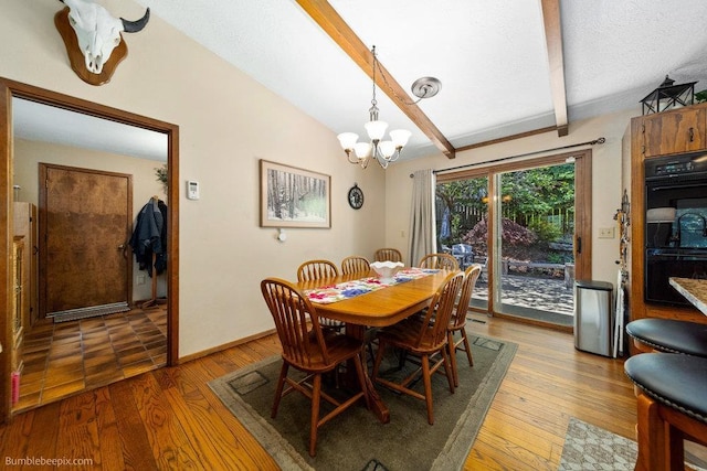 4012 S Terra Verde Dr, Veradale, WA 99037 - dining area with a chandelier, wood finished floors, and baseboards