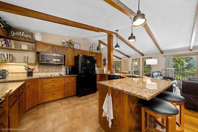 4012 S Terra Verde Dr, Veradale, WA 99037 - kitchen featuring black appliances, a sink, a peninsula, open floor plan, and tasteful backsplash