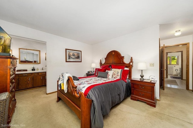 4012 S Terra Verde Dr, Veradale, WA 99037 - bedroom featuring light carpet, ensuite bath, and baseboards