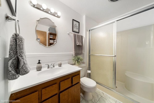 4012 S Terra Verde Dr, Veradale, WA 99037 - full bathroom with a stall shower, vanity, and toilet