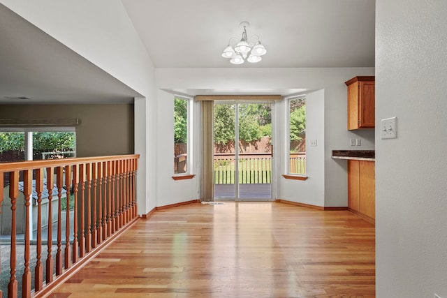 8115 E Sommerset Dr, Spokane, WA 99212 - interior space featuring healthy amount of natural light, a chandelier, and light wood-style floors