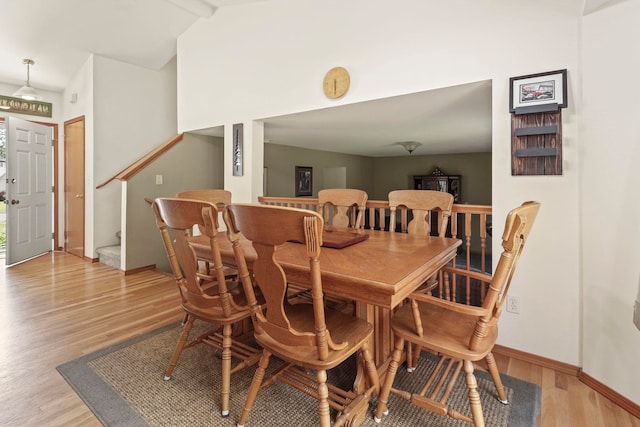 8115 E Sommerset Dr, Spokane, WA 99212 - dining space with light wood-style floors, stairs, lofted ceiling, and baseboards