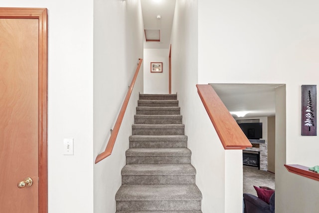 8115 E Sommerset Dr, Spokane, WA 99212 - stairs featuring a fireplace and carpet