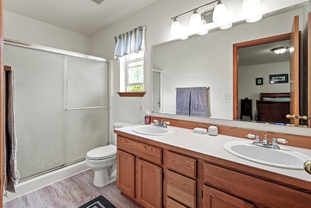 8115 E Sommerset Dr, Spokane, WA 99212 - full bath with a shower stall, double vanity, and wood finished floors