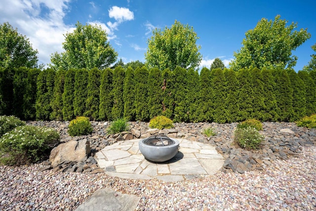 10697 N Crimson Dr, Hayden, ID 83835 - view of yard featuring a fire pit and a patio area