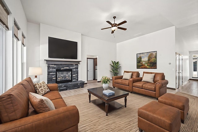 10697 N Crimson Dr, Hayden, ID 83835 - living area with light wood-style floors, ceiling fan, and a fireplace
