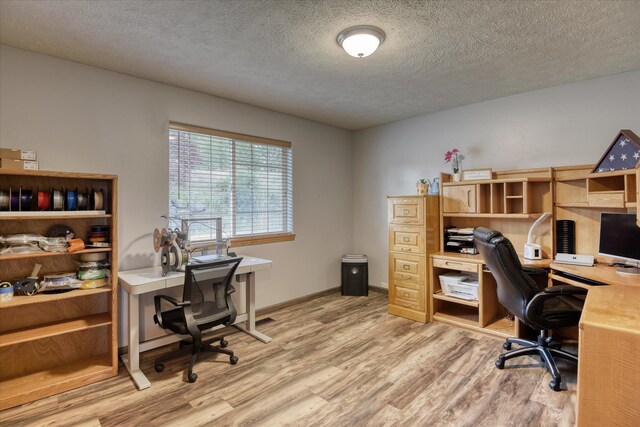 6930 N N Lynden Ln, Otis Orchards, WA 99027 - office with light wood-style flooring, a textured ceiling, and baseboards