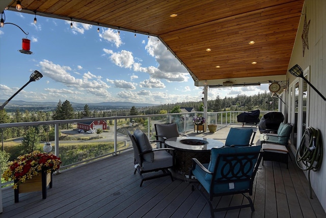 6930 N N Lynden Ln, Otis Orchards, WA 99027 - wooden terrace featuring an outdoor fire pit and a mountain view