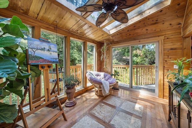 1411 W Spring Ln, Spokane, WA 99218 - sunroom / solarium featuring plenty of natural light, wooden walls, a skylight, and wood-type flooring