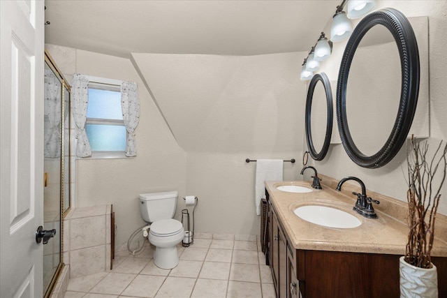 1411 W Spring Ln, Spokane, WA 99218 - bathroom featuring a shower with door, double vanity, and tile patterned floors