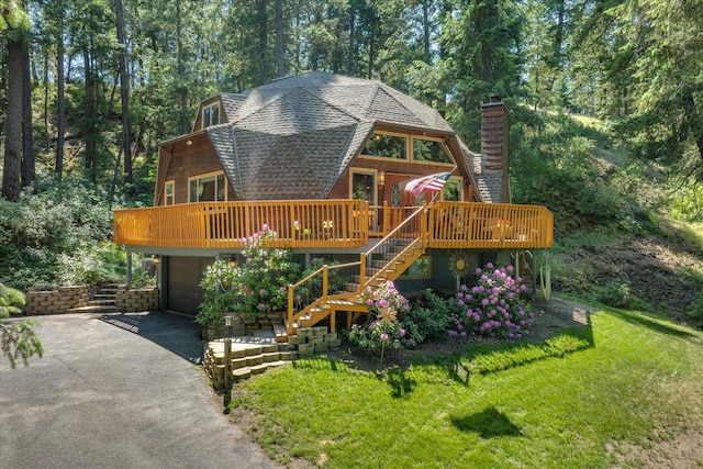 1411 W Spring Ln, Spokane, WA 99218 - view of front of house featuring roof with shingles, a chimney, a garage, stairway, and driveway