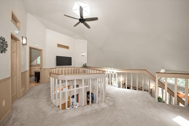 1411 W Spring Ln, Spokane, WA 99218 - corridor featuring carpet flooring, an upstairs landing, a wainscoted wall, and high vaulted ceiling