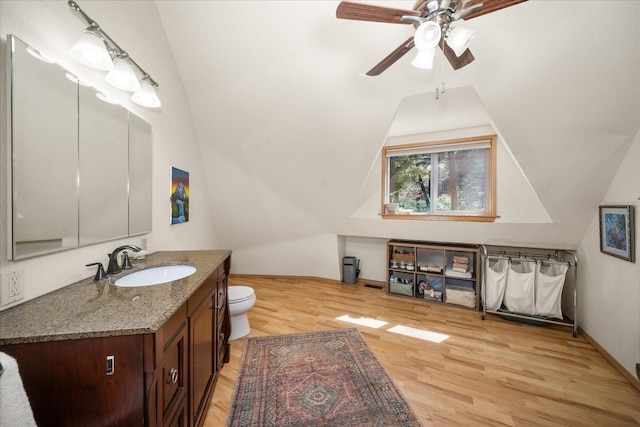 1411 W Spring Ln, Spokane, WA 99218 - bathroom featuring vanity, wood finished floors, lofted ceiling, and a ceiling fan