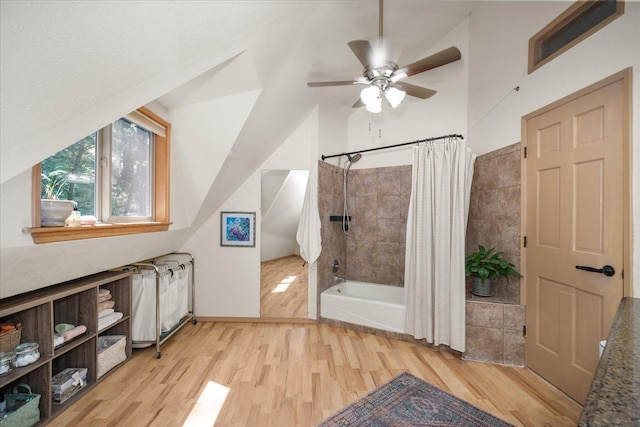 1411 W Spring Ln, Spokane, WA 99218 - bathroom featuring wood finished floors, shower / bath combo, a ceiling fan, and lofted ceiling