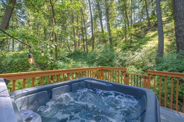 1411 W Spring Ln, Spokane, WA 99218 - wooden deck featuring a hot tub and a wooded view