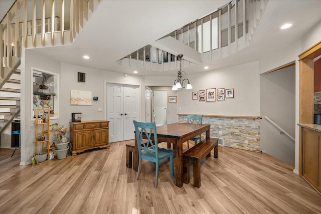 1411 W Spring Ln, Spokane, WA 99218 - dining area with stairway, a towering ceiling, light wood-style floors, a chandelier, and recessed lighting