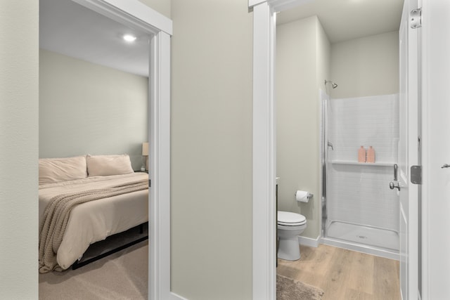 2409 N Leah Ln, Ellensburg, WA 98926 - ensuite bathroom featuring a stall shower, toilet, and wood finished floors