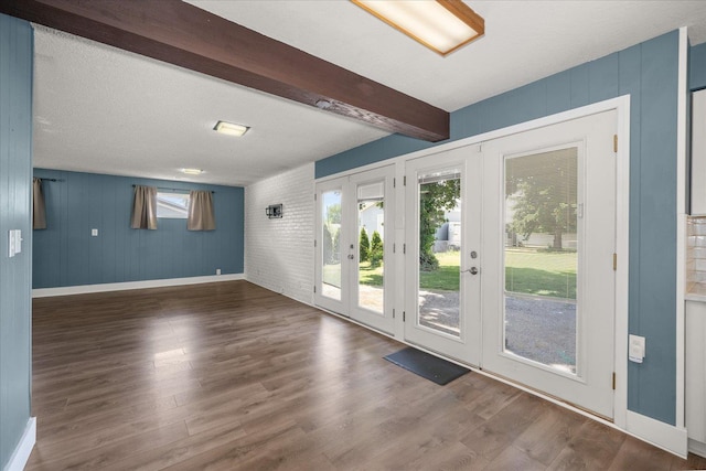 519 N Bannen Rd, Spokane Valley, WA 99216 - unfurnished room with baseboards, french doors, wood finished floors, and beam ceiling