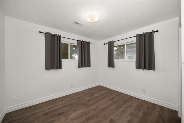 519 N Bannen Rd, Spokane Valley, WA 99216 - unfurnished room with dark wood-style flooring and baseboards
