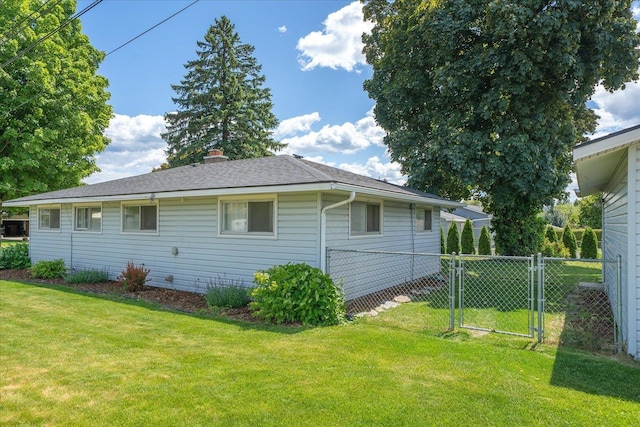 519 N Bannen Rd, Spokane Valley, WA 99216 - view of side of home with a chimney, roof with shingles, and a gate