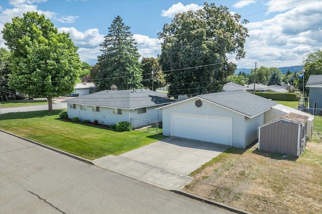 519 N Bannen Rd, Spokane Valley, WA 99216 - single story home featuring an outbuilding, a front yard, and concrete driveway