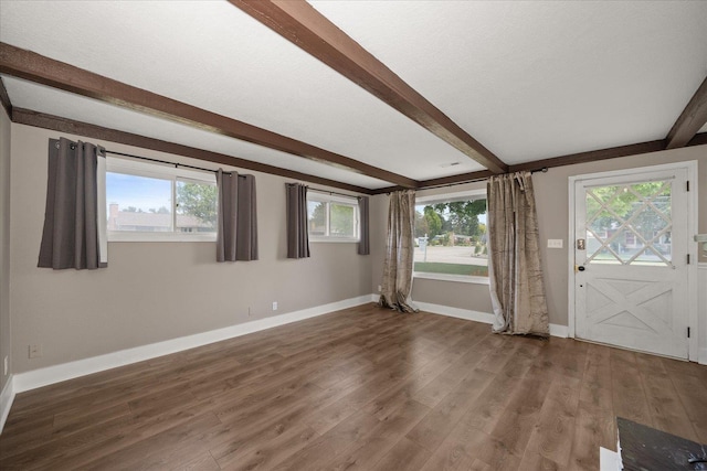 519 N Bannen Rd, Spokane Valley, WA 99216 - foyer featuring beamed ceiling, baseboards, wood finished floors, and plenty of natural light