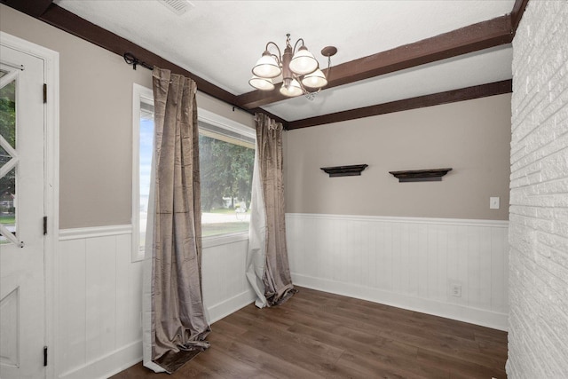 519 N Bannen Rd, Spokane Valley, WA 99216 - unfurnished dining area featuring wainscoting, a chandelier, and dark wood-style floors