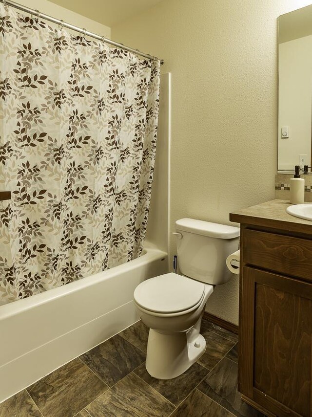 9705 E 4th Ave Unit 9707, Spokane Valley, WA 99206 - full bath with vanity, shower / tub combo with curtain, and toilet