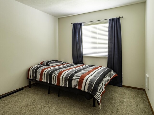 9705 E 4th Ave Unit 9707, Spokane Valley, WA 99206 - bedroom with carpet floors and baseboards