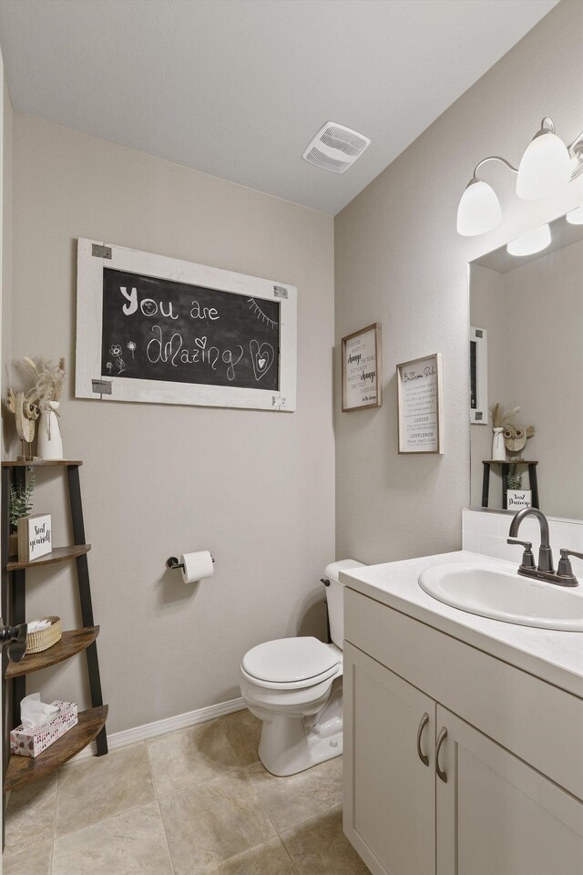 13616 W Pine Bluff Rd, Nine Mile Falls, WA 99026 - bathroom featuring toilet, vanity, and baseboards
