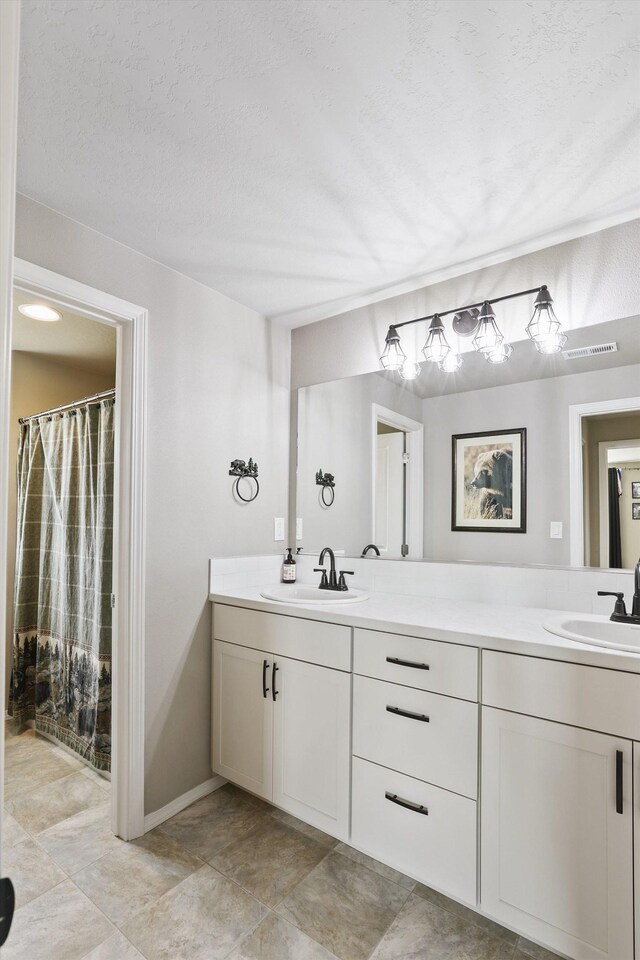 13616 W Pine Bluff Rd, Nine Mile Falls, WA 99026 - full bath featuring double vanity, baseboards, and a shower with shower curtain