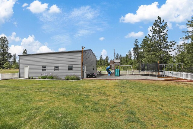 13616 W Pine Bluff Rd, Nine Mile Falls, WA 99026 - back of house featuring a playground and a trampoline
