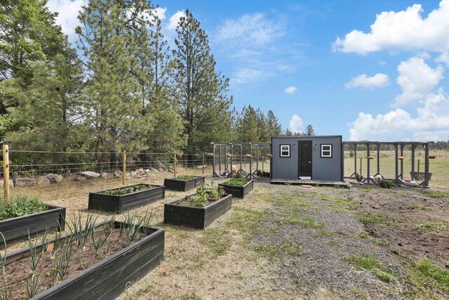 13616 W Pine Bluff Rd, Nine Mile Falls, WA 99026 - view of yard featuring a garden and an outbuilding
