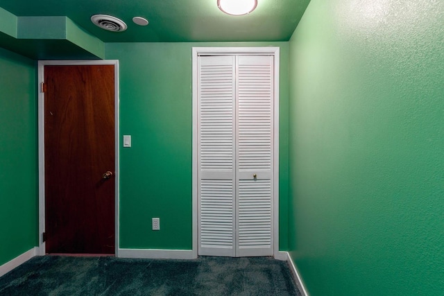 6721 N Howard St, Spokane, WA 99208 - unfurnished bedroom with dark colored carpet and a closet