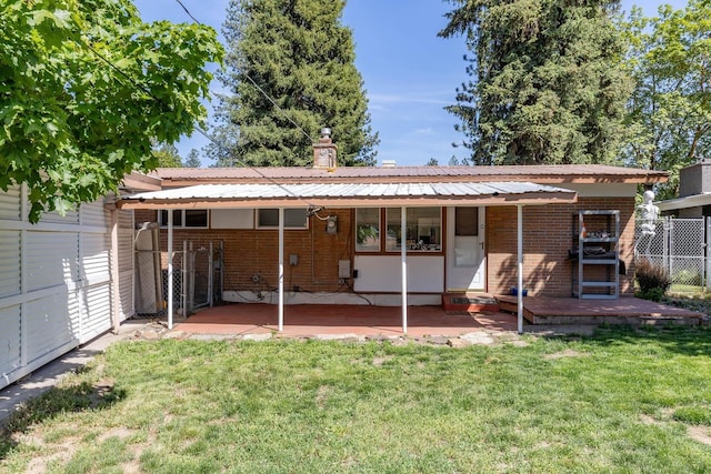 6721 N Howard St, Spokane, WA 99208 - rear view of property with brick siding, a metal roof, and a chimney