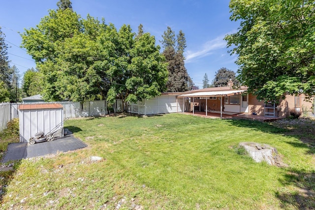 6721 N Howard St, Spokane, WA 99208 - fenced backyard featuring a shed and a patio area