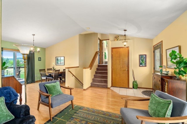 23823 E Garland Ave, Otis Orchards, WA 99027 - living area with vaulted ceiling, stairs, light wood-style floors, and a chandelier