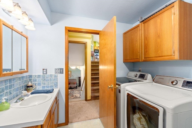 23823 E Garland Ave, Otis Orchards, WA 99027 - laundry area with separate washer and dryer, cabinet space, and light carpet