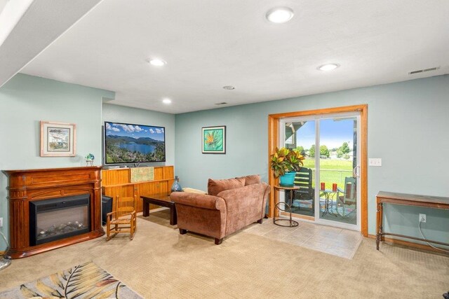 23823 E Garland Ave, Otis Orchards, WA 99027 - carpeted living area with recessed lighting, a glass covered fireplace, and baseboards