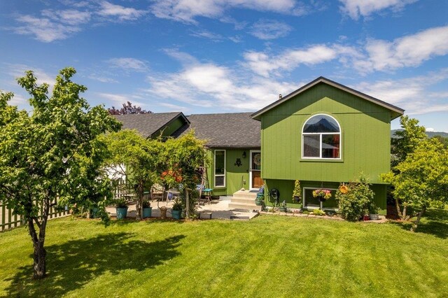 23823 E Garland Ave, Otis Orchards, WA 99027 - view of front of home with a front yard and roof with shingles