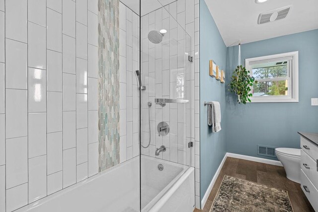 4318 S Magnolia St, Spokane, WA 99203 - full bath featuring baseboards, vanity, bathtub / shower combination, and toilet