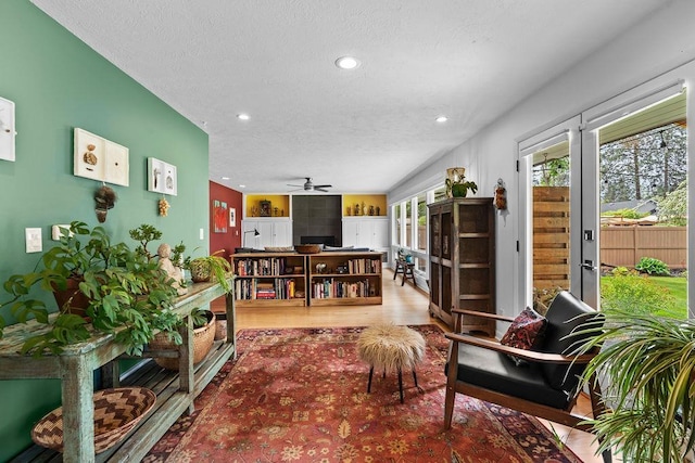 4318 S Magnolia St, Spokane, WA 99203 - living room featuring ceiling fan, a textured ceiling, wood finished floors, and recessed lighting