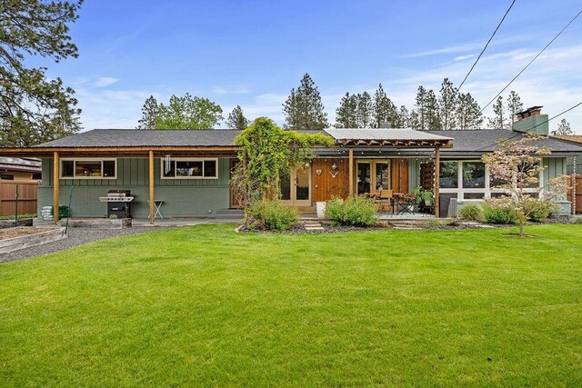 4318 S Magnolia St, Spokane, WA 99203 - rear view of house featuring a patio area, a lawn, and french doors