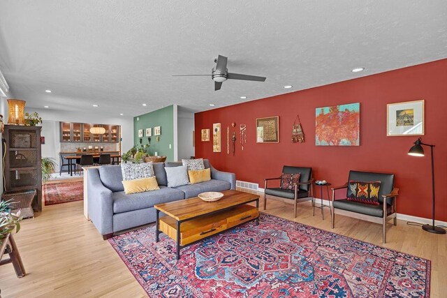 4318 S Magnolia St, Spokane, WA 99203 - living room featuring wood finished floors, ceiling fan, recessed lighting, and a textured ceiling