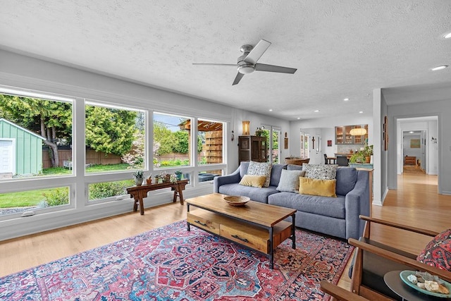 4318 S Magnolia St, Spokane, WA 99203 - living area featuring ceiling fan, a textured ceiling, plenty of natural light, light wood-style flooring, and recessed lighting