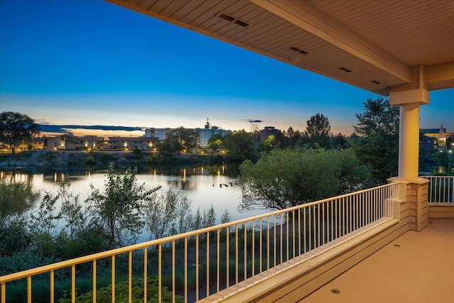 639 N Riverpoint Blvd Unit 7-W, Spokane, WA 99202 - balcony at dusk with a water view