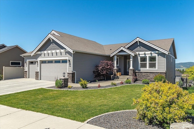 1616 S Morningside Heights Dr, Greenacres, WA 99016 - craftsman-style house with stone siding, an attached garage, and concrete driveway